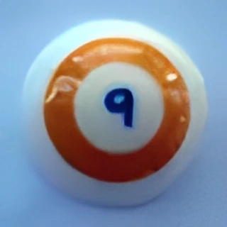 A round object with an orange ring and the number 9 in blue on a white background.
