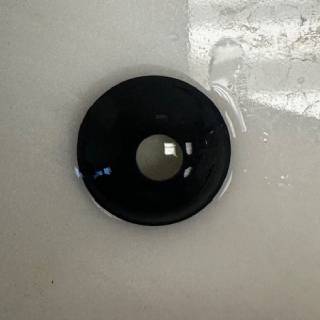 A black hole in the wall of a bathroom.